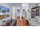 Comfortable living room has a flatscreen television, hardwood floors, and hallway and bathroom access at 1857 Culbertson Ave. # 1857, Myrtle Beach, SC 29577
