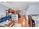 Open-concept living space with hardwood floors flows into a kitchen with bar seating at 1857 Culbertson Ave. # 1857, Myrtle Beach, SC 29577