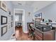 Office features hardwood floors, neutral paint, natural light, and a computer and printer setup at 1857 Culbertson Ave. # 1857, Myrtle Beach, SC 29577