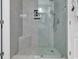 Modern tiled shower with glass enclosure, rainfall showerhead, and built-in niche for toiletries at 1857 Culbertson Ave. # 1857, Myrtle Beach, SC 29577