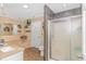 Modern bathroom with a separate shower and tub, sleek fixtures, and tiled accents at 189 Aspen Loop, Pawleys Island, SC 29585