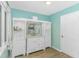 Bathroom features a white vanity with a marble countertop, a mirror, and open shelving at 189 Aspen Loop, Pawleys Island, SC 29585