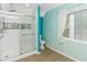 Updated bathroom with modern shower, glass door, white tile surround, and natural light at 189 Aspen Loop, Pawleys Island, SC 29585