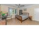 Bright bedroom with wood flooring, a large window, and a ceiling fan, perfect for relaxing and unwinding at 189 Aspen Loop, Pawleys Island, SC 29585