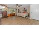 Comfortable bedroom with a ceiling fan, large window and ample natural light, and hardwood flooring at 189 Aspen Loop, Pawleys Island, SC 29585