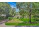 Charming two-story home with a well-maintained lawn and lush garden in a tranquil, tree-lined setting at 189 Aspen Loop, Pawleys Island, SC 29585