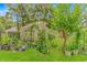 Backyard scene with a charming greenhouse and a lush garden at 189 Aspen Loop, Pawleys Island, SC 29585