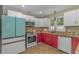 Bright kitchen features stainless steel appliances, tile backsplash, and a modern, colorful aesthetic at 189 Aspen Loop, Pawleys Island, SC 29585