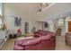 Spacious living area with soaring ceilings and natural light plus wood-look floors and a comfortable leather sofa at 189 Aspen Loop, Pawleys Island, SC 29585