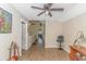 Cozy loft area with a ceiling fan, hardwood floors, and a view overlooking the house at 189 Aspen Loop, Pawleys Island, SC 29585