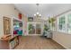 Open sunroom featuring wood floors, abundant natural light, and views of the outdoor living space at 189 Aspen Loop, Pawleys Island, SC 29585