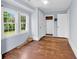 Bright bedroom featuring natural light, a built-in closet, and hardwood floors at 203 Lakeland Dr., Conway, SC 29526