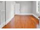 Bright bedroom with hardwood floors, light gray walls, and white trim at 203 Lakeland Dr., Conway, SC 29526
