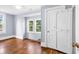 Charming bedroom featuring a built-in wardrobe, natural light, and hardwood floors at 203 Lakeland Dr., Conway, SC 29526