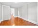 Bedroom with hardwood floors, light gray walls, and white trim at 203 Lakeland Dr., Conway, SC 29526