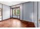 Spacious bedroom featuring natural light, hardwood floors, and classic trim at 203 Lakeland Dr., Conway, SC 29526