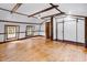 Bright bedroom features hardwood floors, exposed beam ceiling, and access to an adjacent closet at 203 Lakeland Dr., Conway, SC 29526