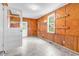 Bonus room with wood-paneled walls, tile floor, exterior door and access to another room at 203 Lakeland Dr., Conway, SC 29526