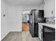 Bright kitchen featuring stainless steel appliances and a view into the next room at 203 Lakeland Dr., Conway, SC 29526