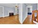 Living room with a white fireplace, hardwood floors, light blue walls, and a ceiling fan at 203 Lakeland Dr., Conway, SC 29526