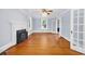 Spacious living room with hardwood floors, fireplace, and a view to the adjacent room at 203 Lakeland Dr., Conway, SC 29526
