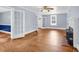 Living room with hardwood floors, brick fireplace and windows that let in natural light at 203 Lakeland Dr., Conway, SC 29526