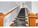 Carpeted stairs with wooden handrail leading to the upper level at 203 Lakeland Dr., Conway, SC 29526