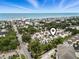 Aerial view highlighting the community's location, proximity to the beach, and abundance of lush greenery at 208 Millwood Dr., Surfside Beach, SC 29575