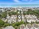 Enjoy coastal living at its finest with this aerial view of a vibrant beach community near the ocean at 208 Millwood Dr., Surfside Beach, SC 29575