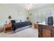 Cozy bedroom with neutral walls, bright white trim and a ceiling fan at 208 Millwood Dr., Surfside Beach, SC 29575