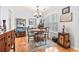 Dining room featuring wood floors, a chandelier, and plenty of natural light at 208 Millwood Dr., Surfside Beach, SC 29575