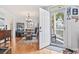 The dining room has hardwood floors, a chandelier and is visible from the entry door at 208 Millwood Dr., Surfside Beach, SC 29575