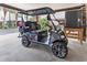 Custom golf cart parked in the carport area, adding to the appeal and functionality of this desirable beach home at 208 Millwood Dr., Surfside Beach, SC 29575