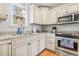 A well-equipped kitchen features stainless steel appliances, granite countertops, and ample cabinet space for storage at 208 Millwood Dr., Surfside Beach, SC 29575