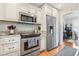 Kitchen showcasing modern appliances, granite countertops, and sleek cabinetry for a stylish cooking experience at 208 Millwood Dr., Surfside Beach, SC 29575