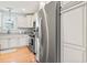 A bright kitchen featuring stainless steel appliances, white cabinetry and granite countertops offers an efficient cooking space at 208 Millwood Dr., Surfside Beach, SC 29575