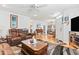 Cozy living room with hard floors, leather seating, and open layout at 208 Millwood Dr., Surfside Beach, SC 29575