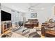Bright living room featuring a ceiling fan, tv, and plush seating at 208 Millwood Dr., Surfside Beach, SC 29575
