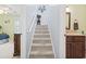 Carpeted staircase between the bedroom and bathroom at 208 Millwood Dr., Surfside Beach, SC 29575