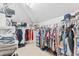 Spacious walk-in closet with ample shelving, multiple hanging rods, and an overhead light at 208 Millwood Dr., Surfside Beach, SC 29575