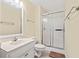 Neutral bathroom featuring a single sink vanity and a walk-in shower with sliding glass doors at 212 29Th Ave. N # 204, North Myrtle Beach, SC 29582