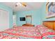 Bedroom with blue walls, a rattan headboard, and an ensuite bathroom at 212 29Th Ave. N # 204, North Myrtle Beach, SC 29582