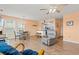 Spacious room with dining area and adjacent kitchen, featuring laminate wood flooring and bright peach colored walls at 212 29Th Ave. N # 204, North Myrtle Beach, SC 29582