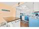 Charming kitchen with blue and white cabinets, stainless steel appliances, and breakfast bar with seating at 212 29Th Ave. N # 204, North Myrtle Beach, SC 29582