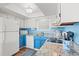 Bright kitchen with white appliances, blue cabinets, and speckled countertops at 212 29Th Ave. N # 204, North Myrtle Beach, SC 29582