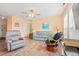 Inviting living room with laminate floors, ceiling fan, comfortable seating and bright, natural light at 212 29Th Ave. N # 204, North Myrtle Beach, SC 29582