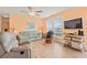 Cozy living room with comfortable seating, a ceiling fan, and a large window with natural light at 212 29Th Ave. N # 204, North Myrtle Beach, SC 29582