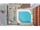 Top-down view of a community pool with lounge chairs and tables, ideal for relaxation at 212 29Th Ave. N # 204, North Myrtle Beach, SC 29582