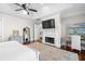 Cozy bedroom featuring a fireplace, sitting area, and ample natural light at 288 Tipperary Pl., Pawleys Island, SC 29585