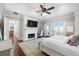 Serene bedroom with a fireplace, balcony access, and beautiful marsh views at 288 Tipperary Pl., Pawleys Island, SC 29585